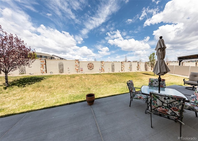 4330 Prairie Agate Dr, Colorado Springs, CO 80938 - fenced backyard featuring a patio and outdoor dining area