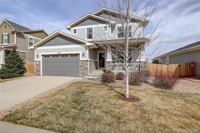 2033 E 167th Way, Thornton, CO 80602 - craftsman-style house featuring a porch, driveway, an attached garage, and stone siding