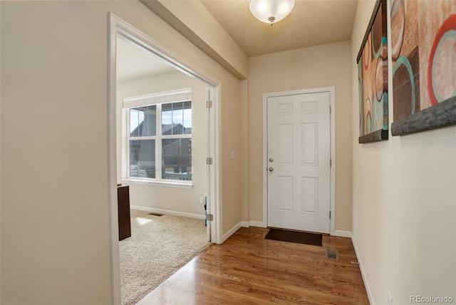 2033 E 167th Way, Thornton, CO 80602 - entryway featuring baseboards and wood finished floors