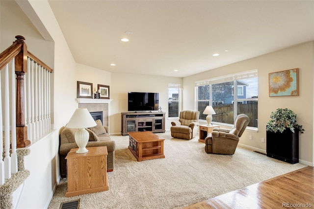 2033 E 167th Way, Thornton, CO 80602 - living room featuring a fireplace, recessed lighting, wood finished floors, and baseboards
