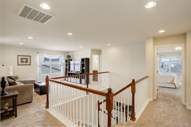 2033 E 167th Way, Thornton, CO 80602 - hallway with an upstairs landing, light carpet, recessed lighting, and baseboards