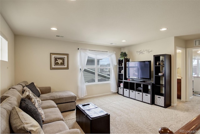 2033 E 167th Way, Thornton, CO 80602 - living area featuring light colored carpet, plenty of natural light, recessed lighting, and baseboards