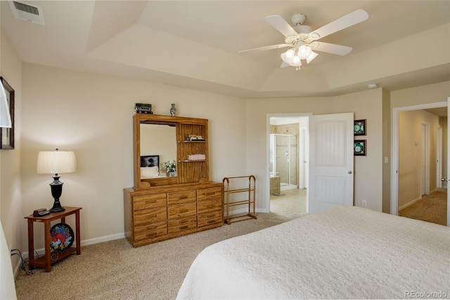 2033 E 167th Way, Thornton, CO 80602 - carpeted bedroom featuring a raised ceiling, baseboards, ensuite bathroom, and a ceiling fan