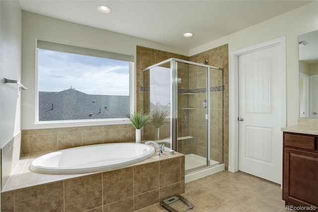 2033 E 167th Way, Thornton, CO 80602 - full bathroom with a garden tub, a stall shower, vanity, tile patterned flooring, and recessed lighting