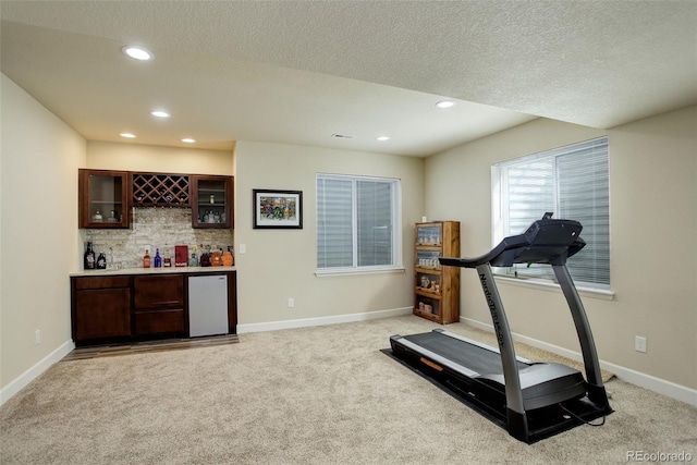 2033 E 167th Way, Thornton, CO 80602 - exercise area with a dry bar, recessed lighting, light carpet, baseboards, and a textured ceiling