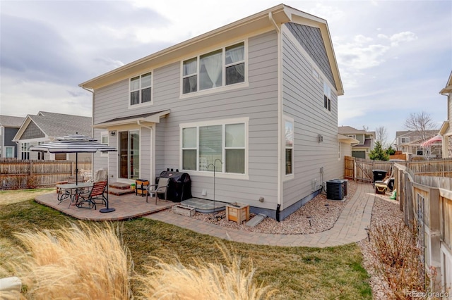 2033 E 167th Way, Thornton, CO 80602 - back of house featuring a patio area and central AC