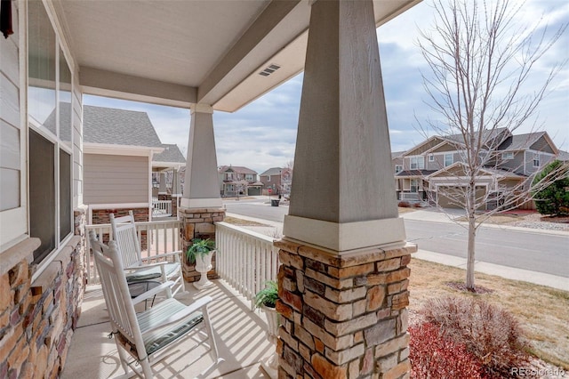 2033 E 167th Way, Thornton, CO 80602 - porch featuring a residential view