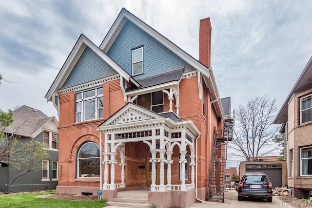 131 N Sherman St, Denver, CO 80203 - victorian home with a chimney and brick siding