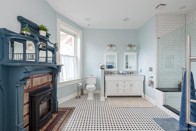 131 N Sherman St, Denver, CO 80203 - full bath featuring a stall shower, a wood stove, toilet, and baseboards