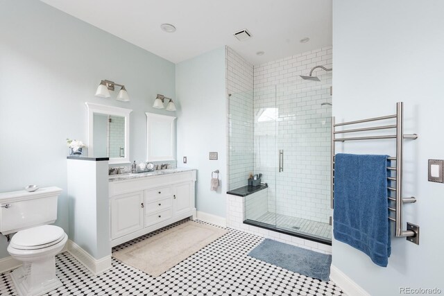131 N Sherman St, Denver, CO 80203 - bathroom featuring a shower stall, toilet, vanity, and baseboards