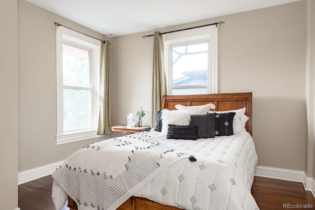 131 N Sherman St, Denver, CO 80203 - bedroom featuring baseboards, wood finished floors, and multiple windows
