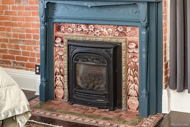 131 N Sherman St, Denver, CO 80203 - detailed view of a fireplace, wood finished floors, and brick wall