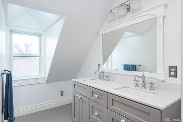 131 N Sherman St, Denver, CO 80203 - bathroom with double vanity, tile patterned floors, and baseboards