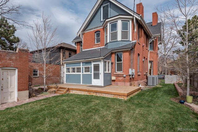 131 N Sherman St, Denver, CO 80203 - back of property with a chimney, a wooden deck, a shingled roof, brick siding, and cooling unit
