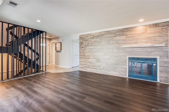 2314 S Troy St, Aurora, CO 80014 - unfurnished living room featuring wood finished floors, recessed lighting, stairs, and a stone fireplace
