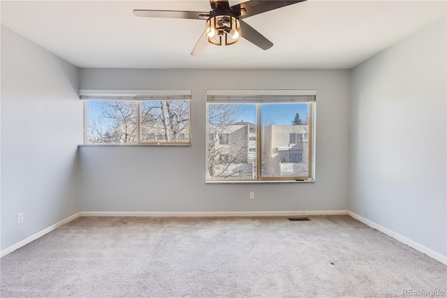 2314 S Troy St, Aurora, CO 80014 - spare room featuring carpet, healthy amount of natural light, and ceiling fan