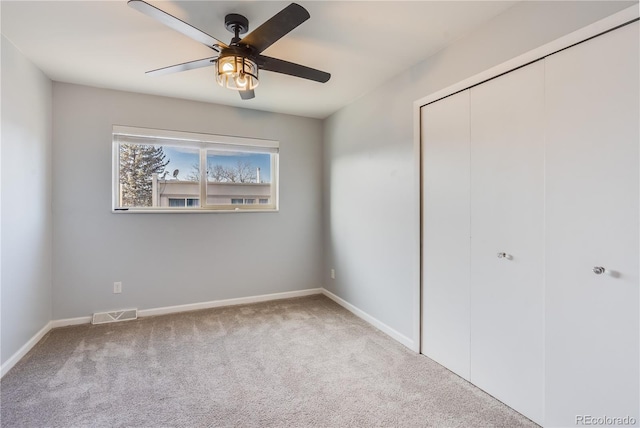 2314 S Troy St, Aurora, CO 80014 - unfurnished bedroom with carpet flooring, a closet, and a ceiling fan
