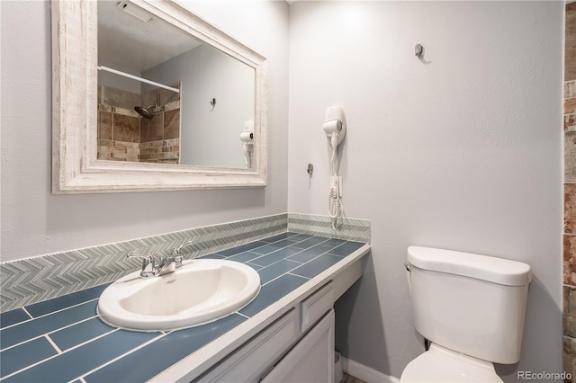 2314 S Troy St, Aurora, CO 80014 - bathroom featuring vanity and a tile shower