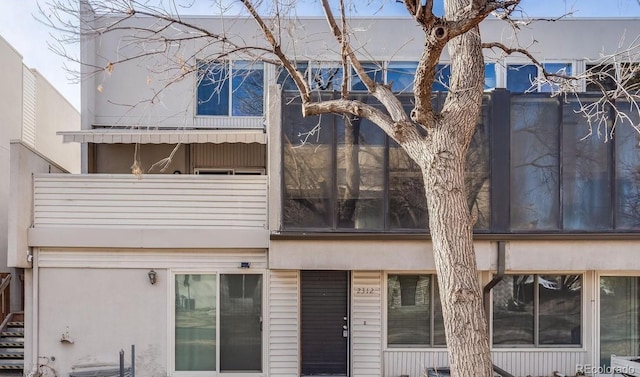 2314 S Troy St, Aurora, CO 80014 - back of property with a balcony and stucco siding
