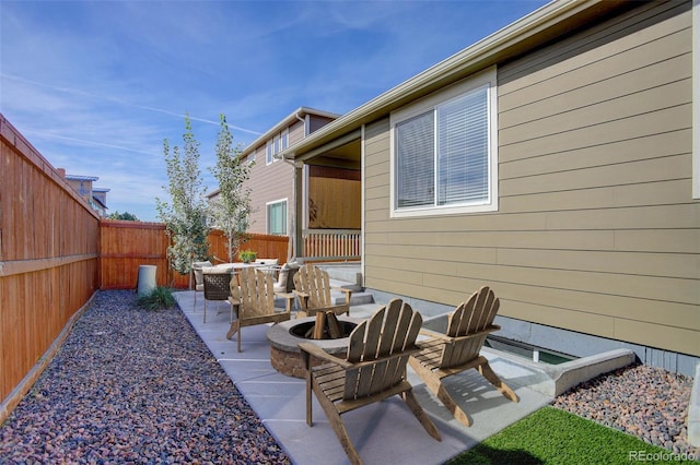 view of patio featuring a fire pit