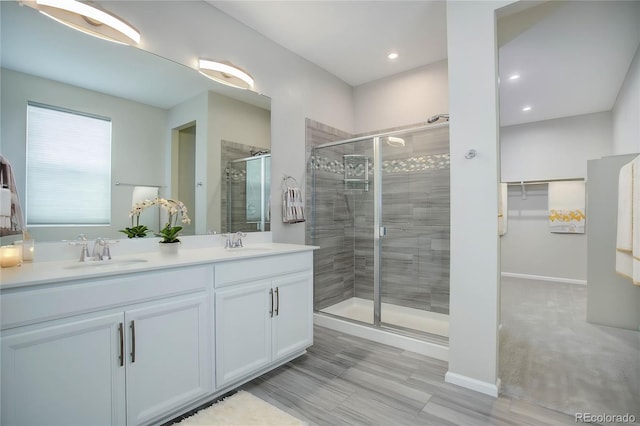 bathroom with vanity and walk in shower