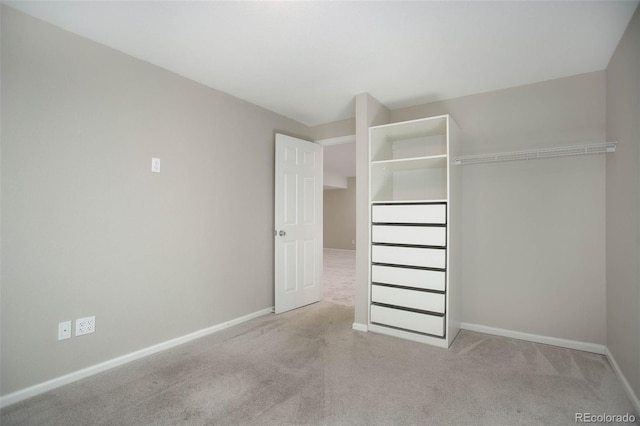 interior space with light carpet and a closet