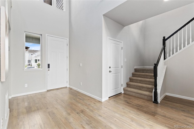 18815 W 93rd Ave, Arvada, CO 80007 - entryway featuring stairway and light wood finished floors