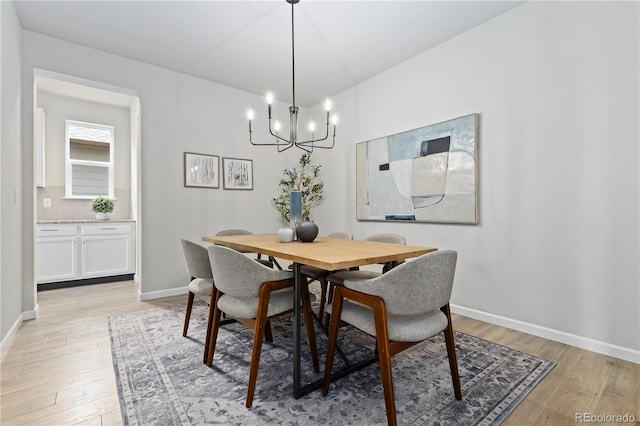 18815 W 93rd Ave, Arvada, CO 80007 - dining area featuring a chandelier and light wood finished floors