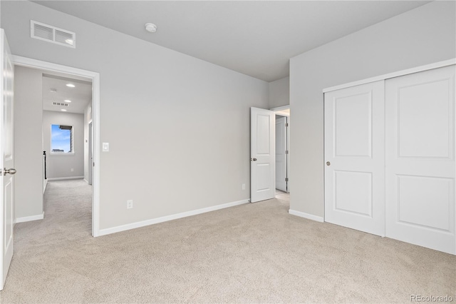 18815 W 93rd Ave, Arvada, CO 80007 - unfurnished bedroom with light carpet, a closet, and recessed lighting