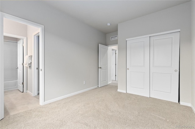 18815 W 93rd Ave, Arvada, CO 80007 - unfurnished bedroom with light carpet, a closet, and connected bathroom