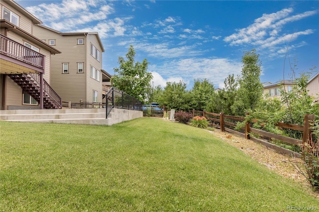 18815 W 93rd Ave, Arvada, CO 80007 - fenced backyard featuring stairs and a deck