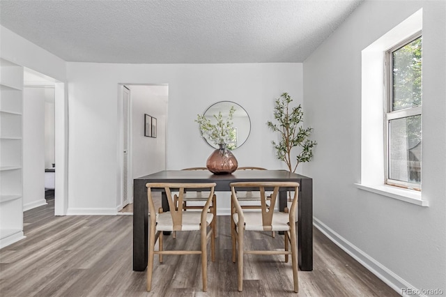 4450 S Fox St, Englewood, CO 80110 - dining area with wood finished floors and a textured ceiling