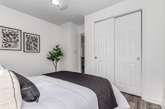 4450 S Fox St, Englewood, CO 80110 - bedroom featuring wood finished floors, a closet, a ceiling fan, and a textured ceiling