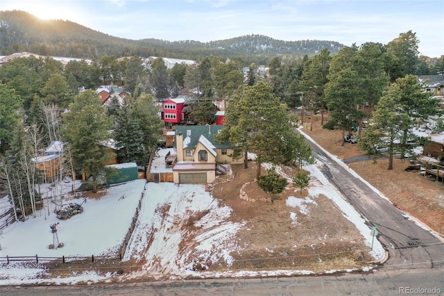 birds eye view of property with a mountain view