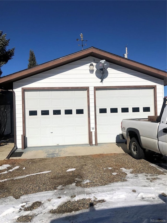 view of snow covered garage