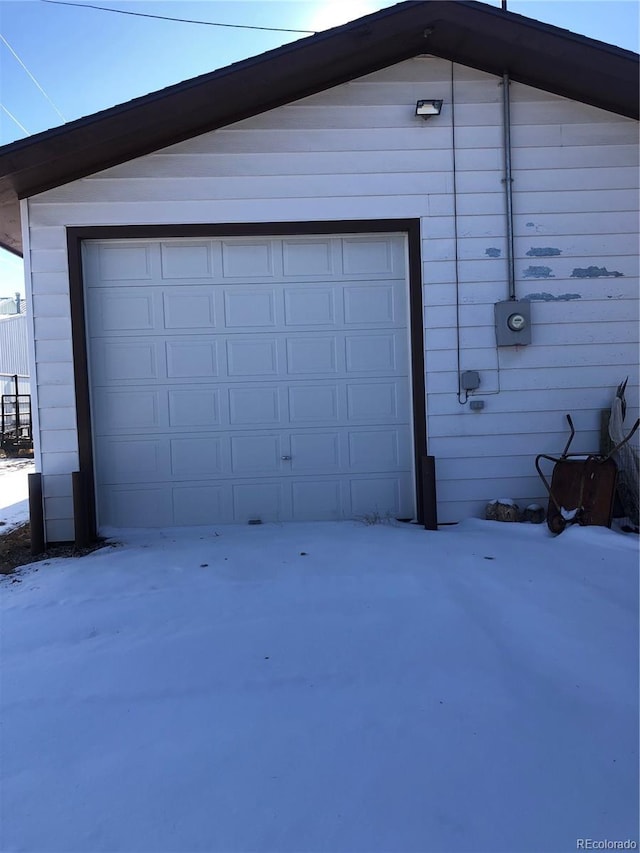 view of snow covered garage