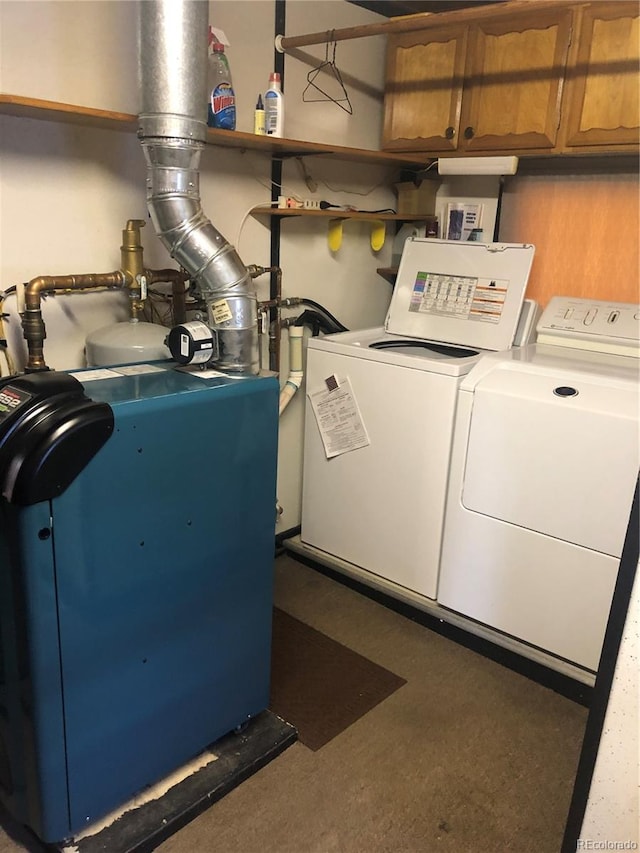 interior space featuring cabinets and washing machine and clothes dryer