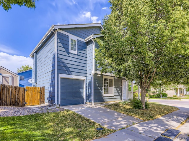 4935 E 100th Dr, Thornton, CO 80229 - view of front of house with driveway and a garage
