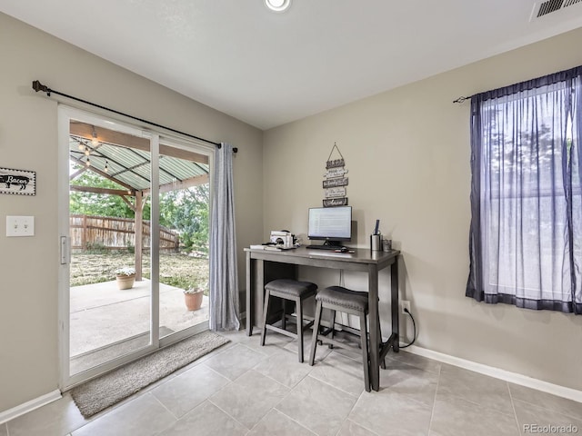 4935 E 100th Dr, Thornton, CO 80229 - office area featuring baseboards and light tile patterned floors