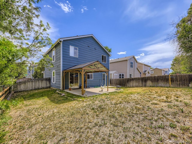 4935 E 100th Dr, Thornton, CO 80229 - rear view of property featuring a gazebo, a patio area, and a fenced backyard