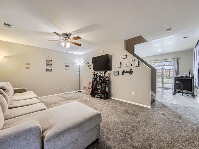 4935 E 100th Dr, Thornton, CO 80229 - living room with light carpet, ceiling fan, and stairway