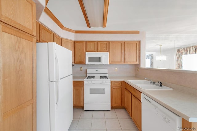 kitchen featuring a sink, white appliances, light countertops, and light tile patterned floors