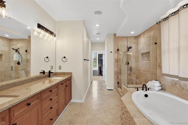 11208 W Ontario Ave, Littleton, CO 80127 - full bath with a bath, a shower stall, double vanity, tile patterned floors, and recessed lighting