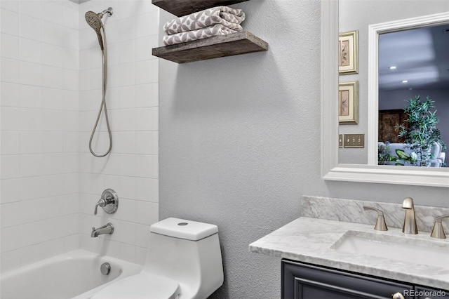 11208 W Ontario Ave, Littleton, CO 80127 - full bath with vanity, shower / bath combination, and a textured wall