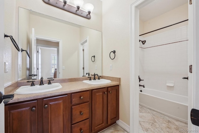 bathroom with shower / bathing tub combination and vanity