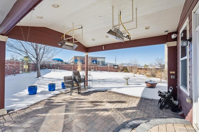 view of snow covered patio