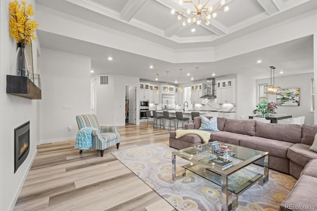 8023 Gore Creek Ln, Littleton, CO 80125 - living room featuring recessed lighting, light wood finished floors, coffered ceiling, beam ceiling, and a glass covered fireplace