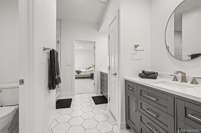 8023 Gore Creek Ln, Littleton, CO 80125 - ensuite bathroom featuring vanity, toilet, and tile patterned flooring