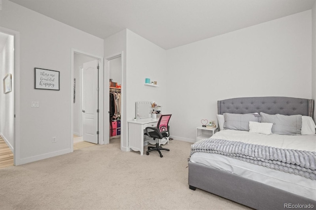 8023 Gore Creek Ln, Littleton, CO 80125 - carpeted bedroom featuring baseboards, a walk in closet, and a closet