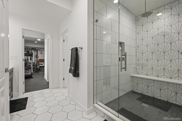 8023 Gore Creek Ln, Littleton, CO 80125 - bathroom with a stall shower, a spacious closet, baseboards, and recessed lighting